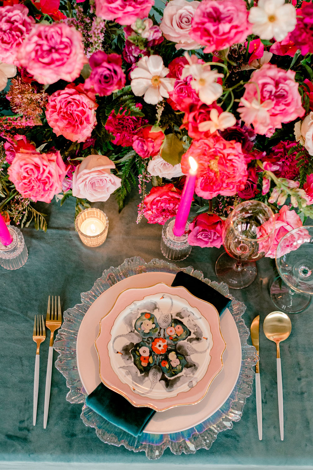 hot pink flower arrangements and elegant place setting