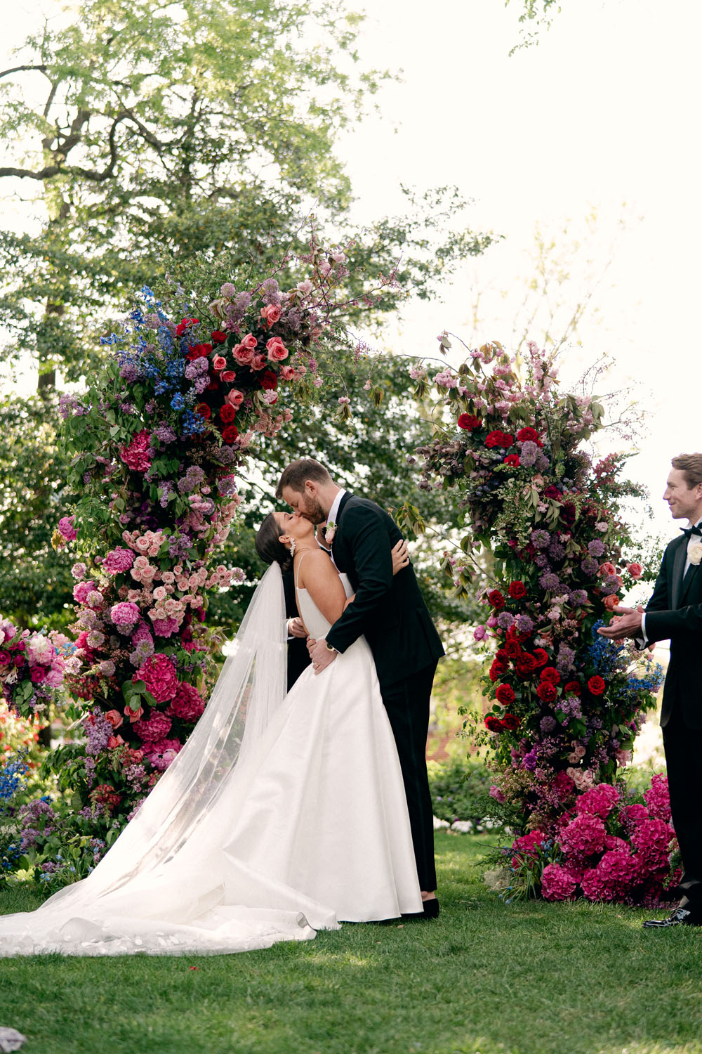 colorful floral ceremony arch at jewel toned meridian house wedding
