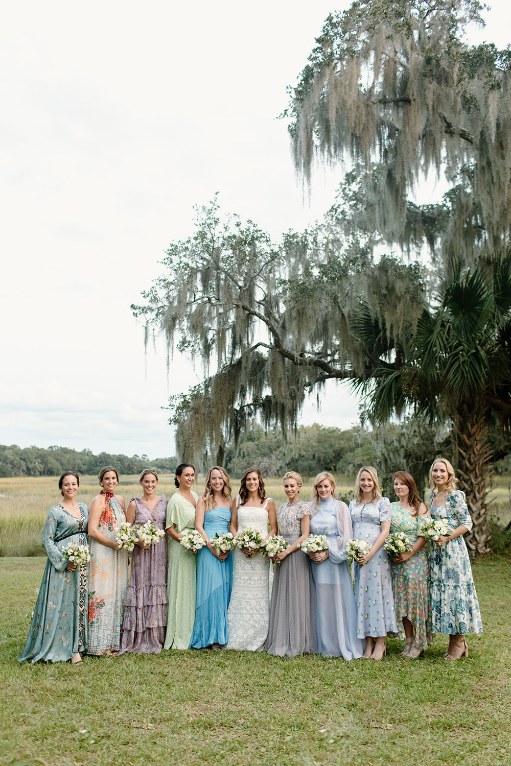 Mismatched bridesmaid dresses at romantic wedding venue in Charleston