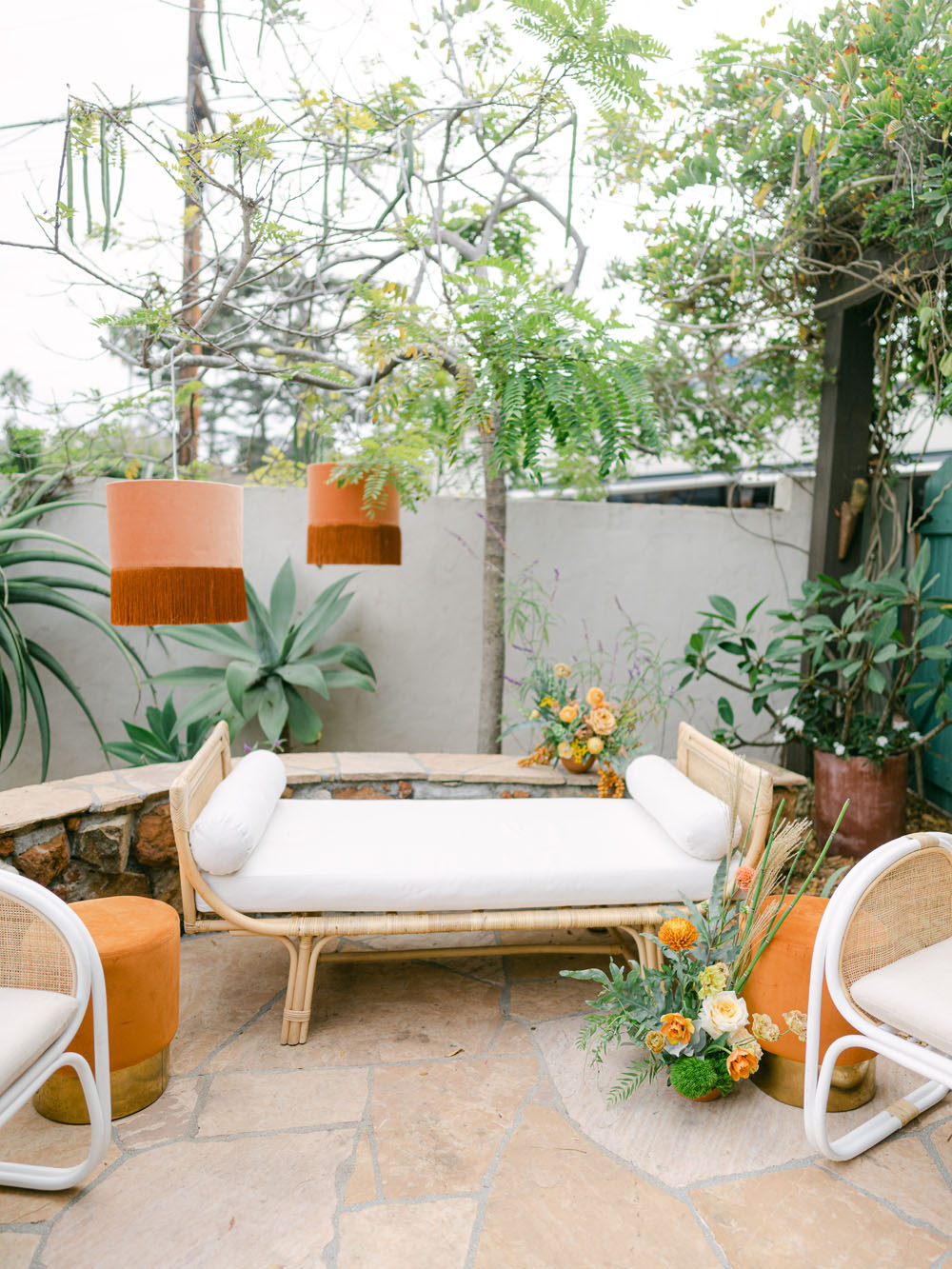 pretty boho lounge area in backyard birthday party