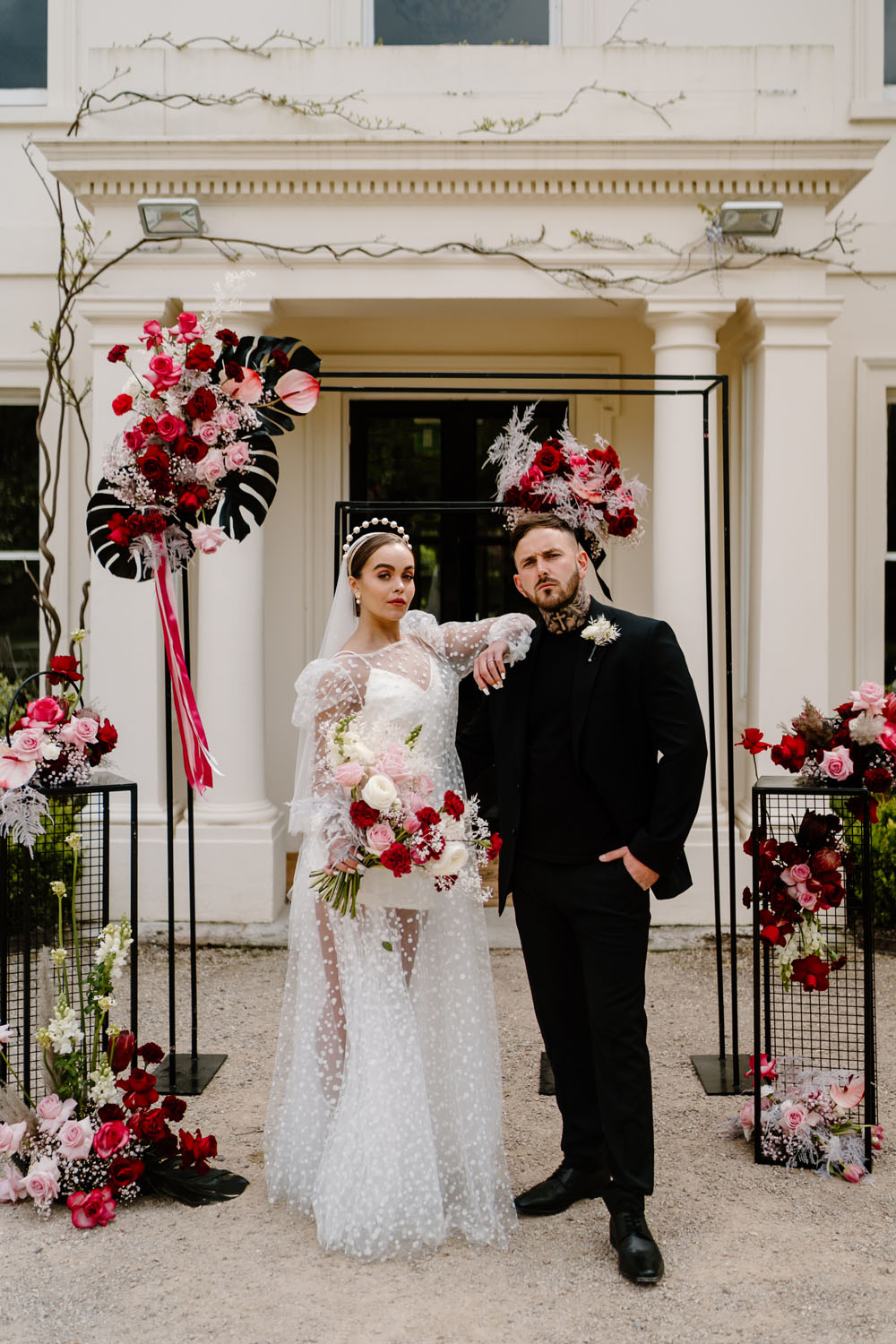 portrait of groom and bride with polka dot wedding dress