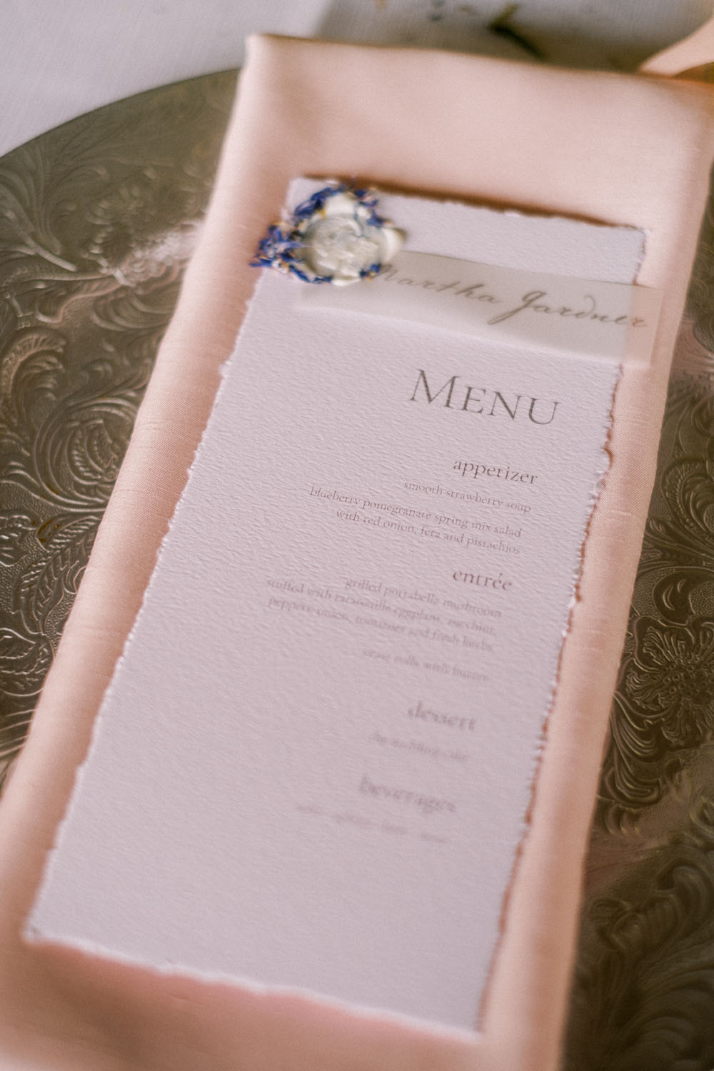 blush napkins and wedding menu