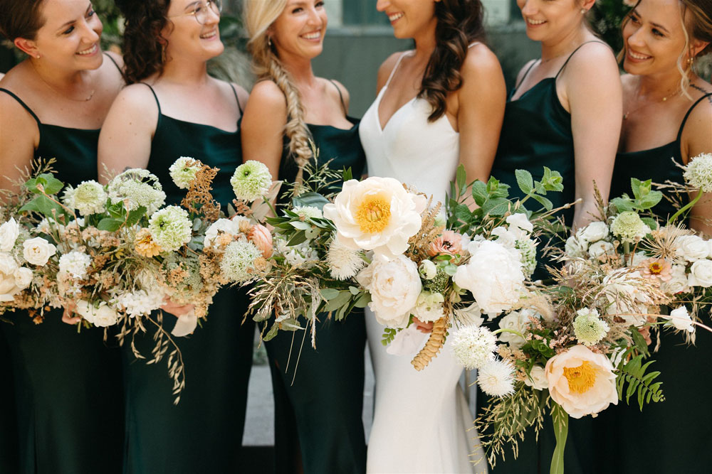 modern Austin wedding with emerald bridesmaids and peonies