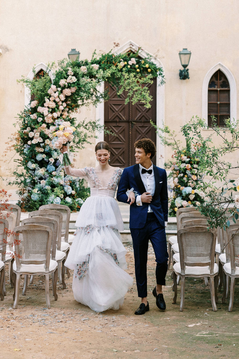 Spring floral ceremony arch at Greek castle wedding