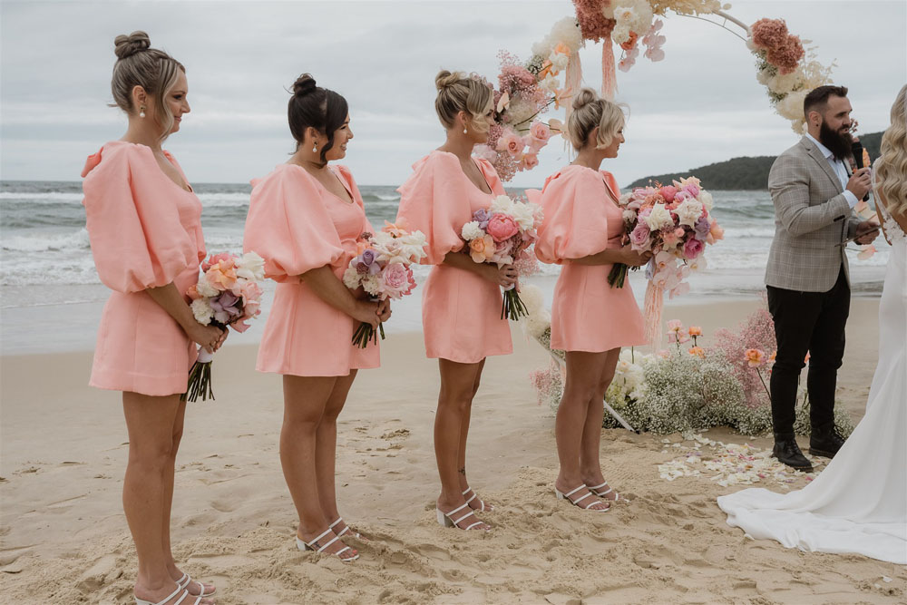 Coastal Australian wedding with pink bridesmaid dresses