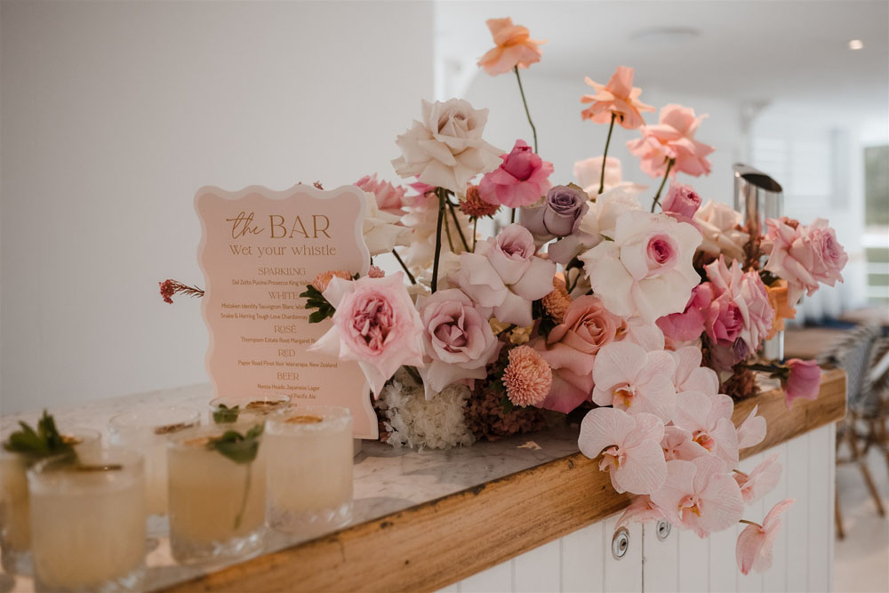 bar sign and pink reflexed roses