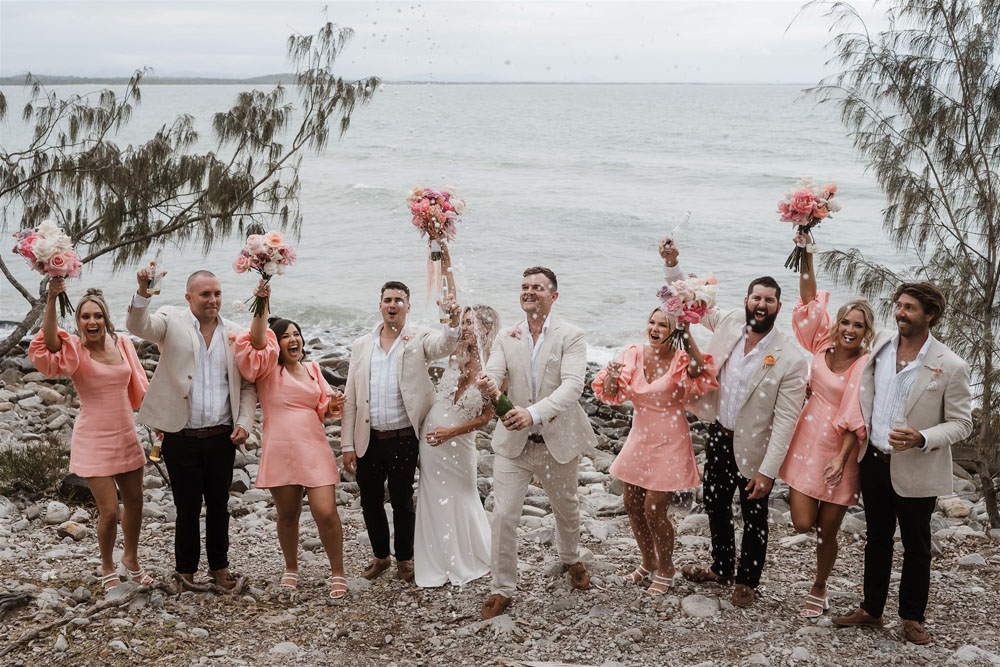 Coastal Australian wedding with pink bridesmaid dresses