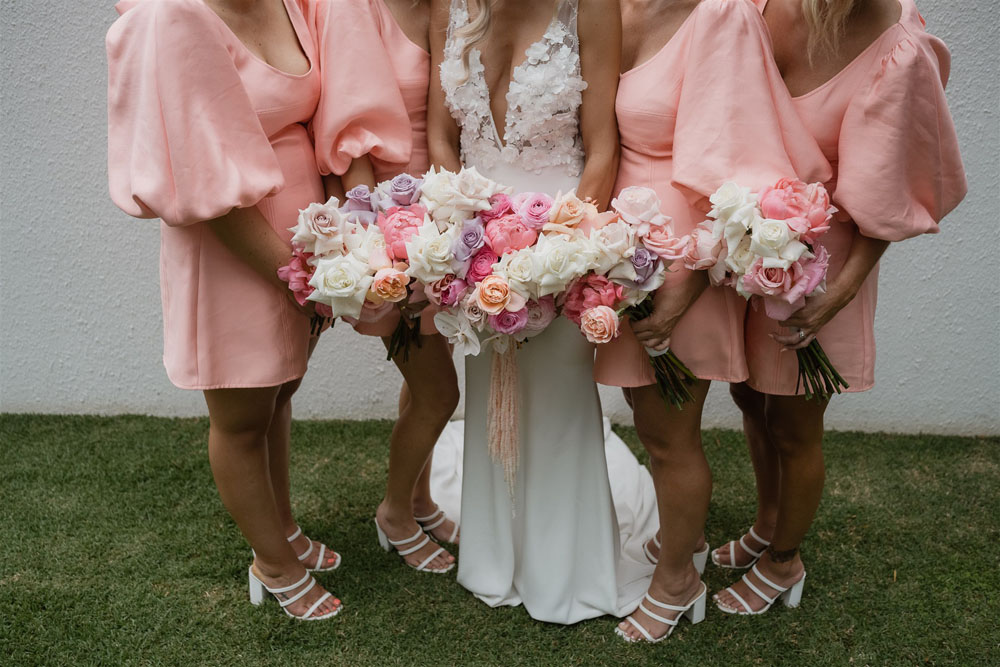 Coastal Australian wedding with pink bridesmaid dresses