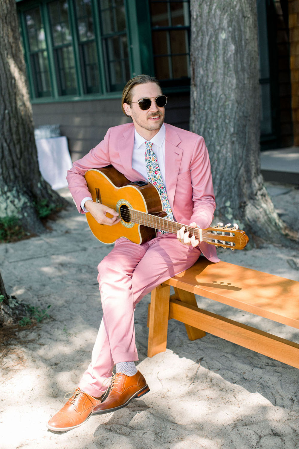 pink grooms suit for whimsical wedding