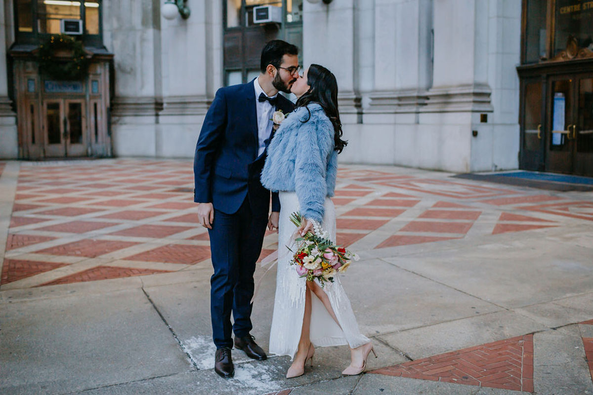 Bride wearing winter coat