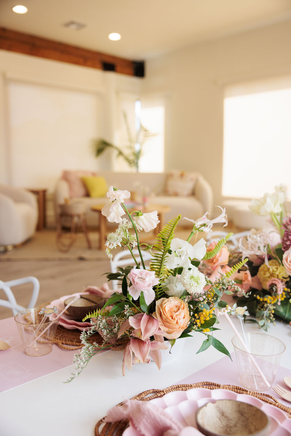 pink floral centerpiece with pineapple