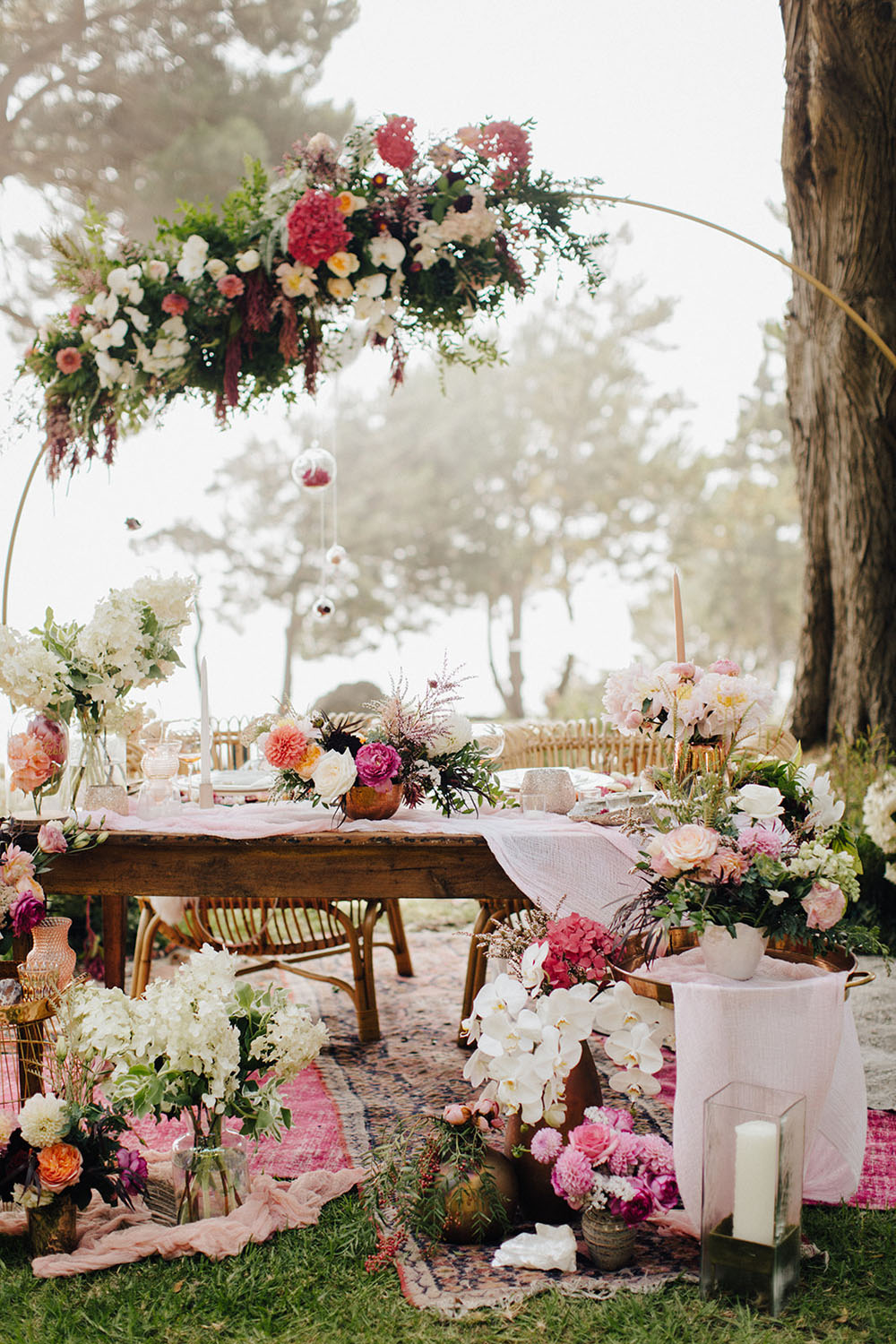 pink and blush floral sweetheart table at garden wedding