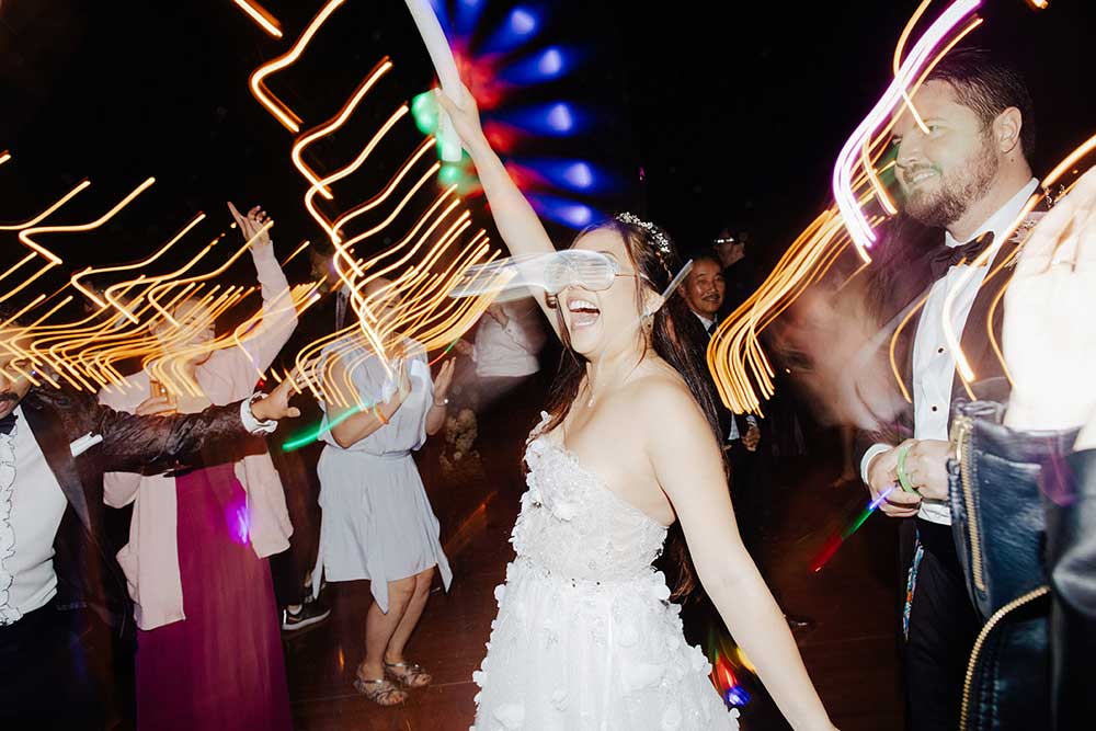 LED sunglasses and glow sticks at wedding dance party