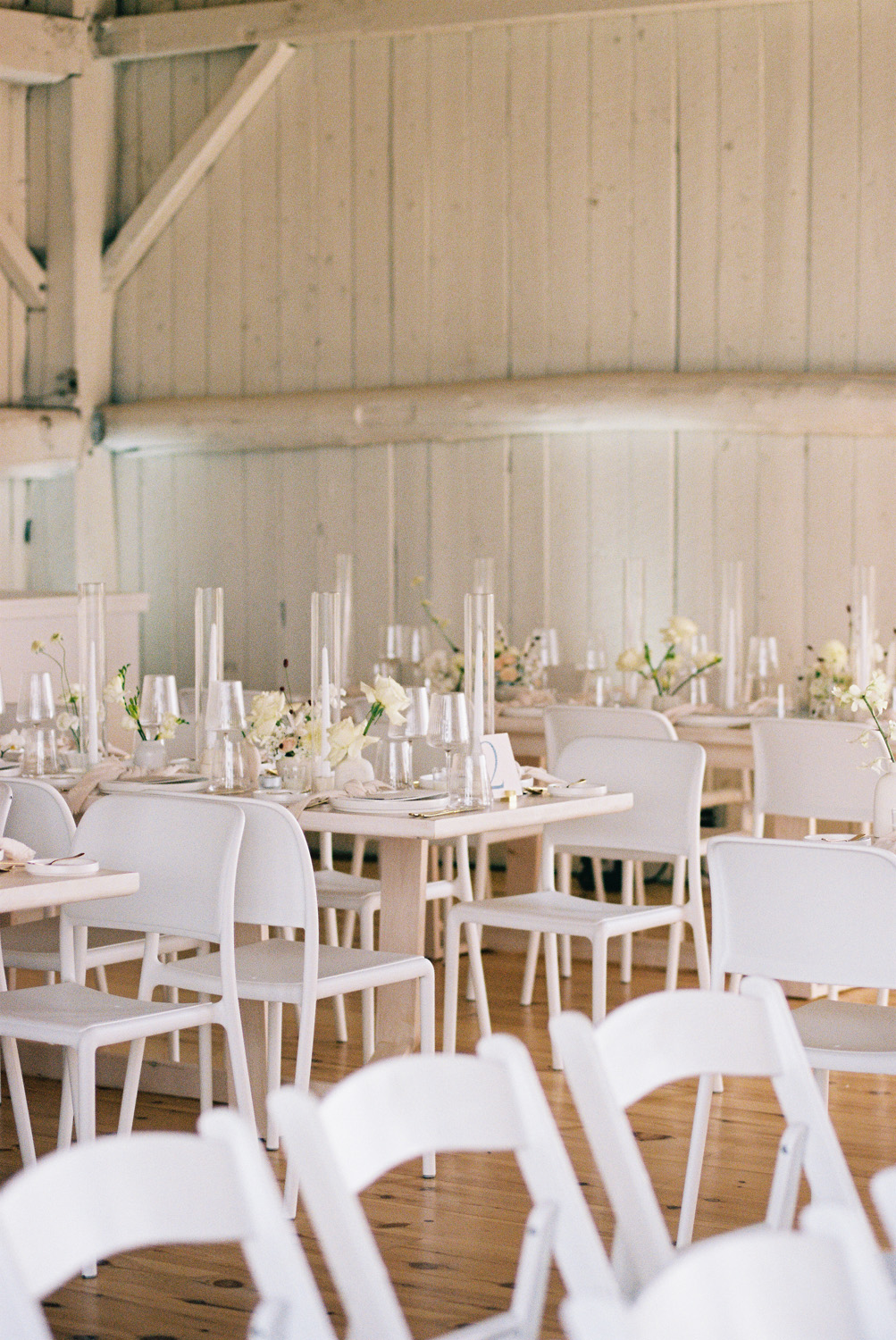 modern all white tables, chairs, and candles