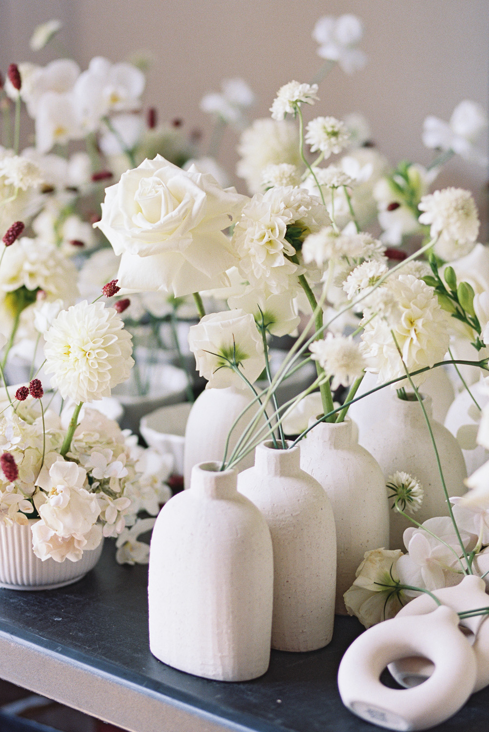 modern stoneware vases and all white wedding flowers