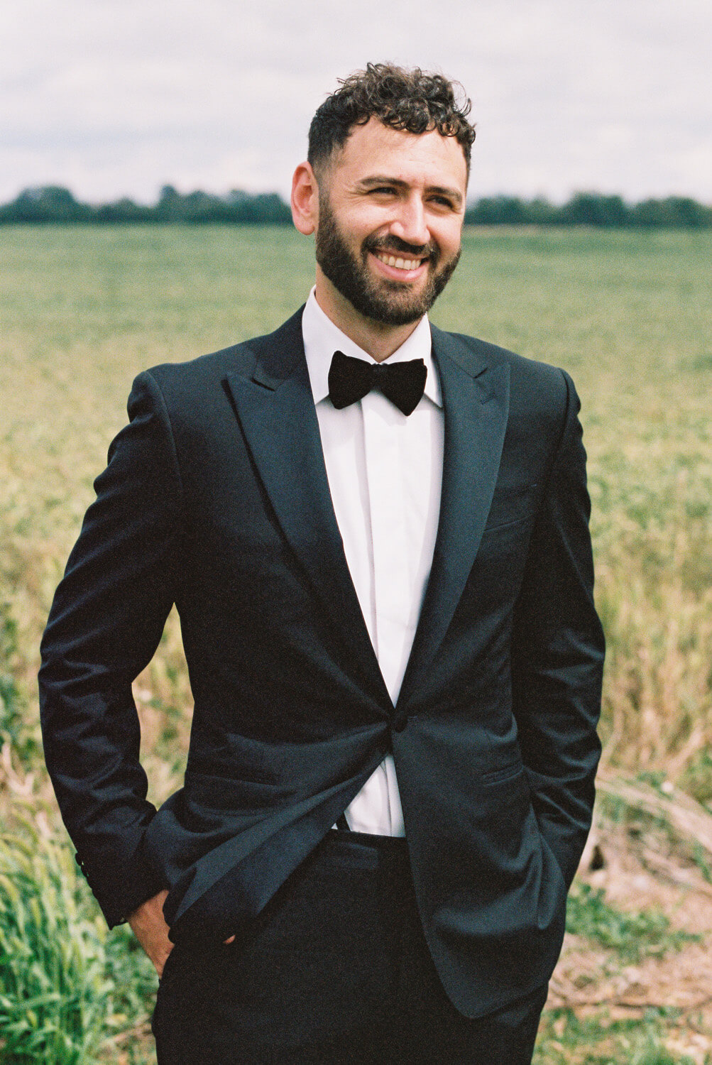 Groom in black tux and bowtie