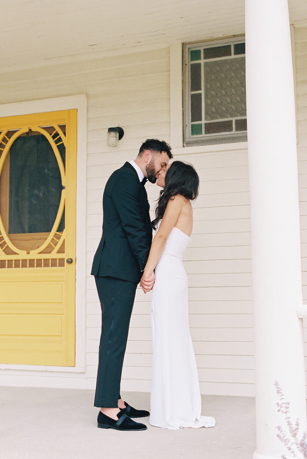 first look portraits at white farmhouse wedding