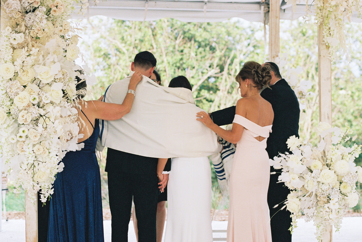 all white wedding chuppah flowers for modern jewish wedding ceremony