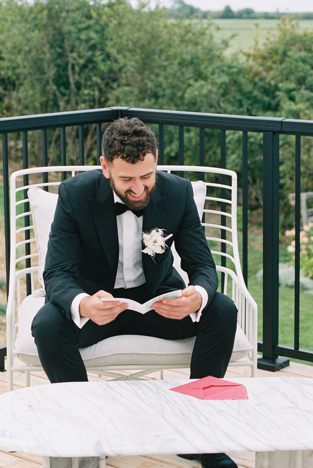 groom reading letter from bride