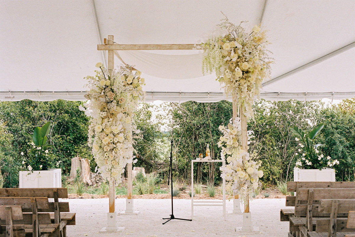 all white wedding chuppah flowers for modern jewish wedding ceremony