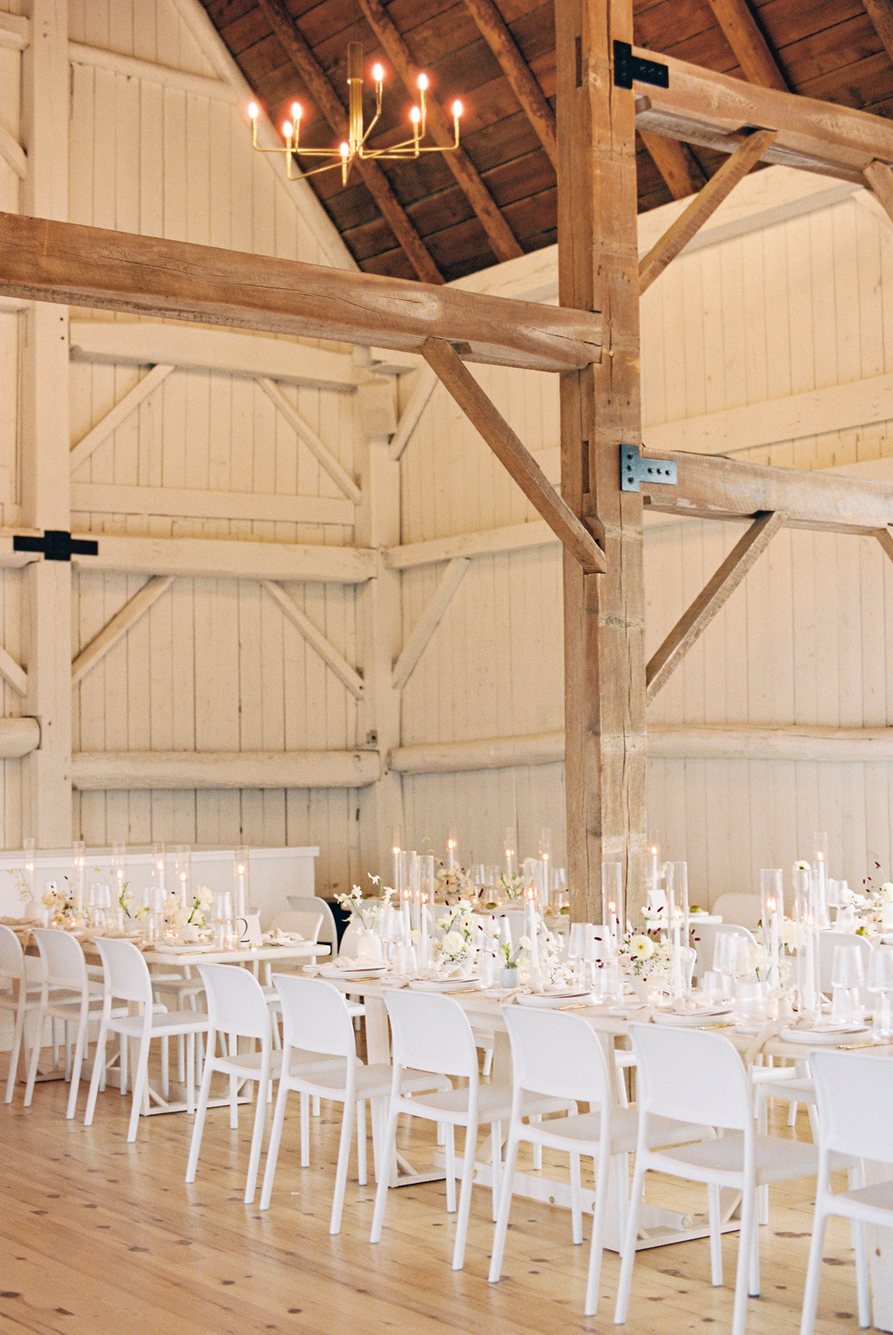 all white wedding tablescape in farmhouse