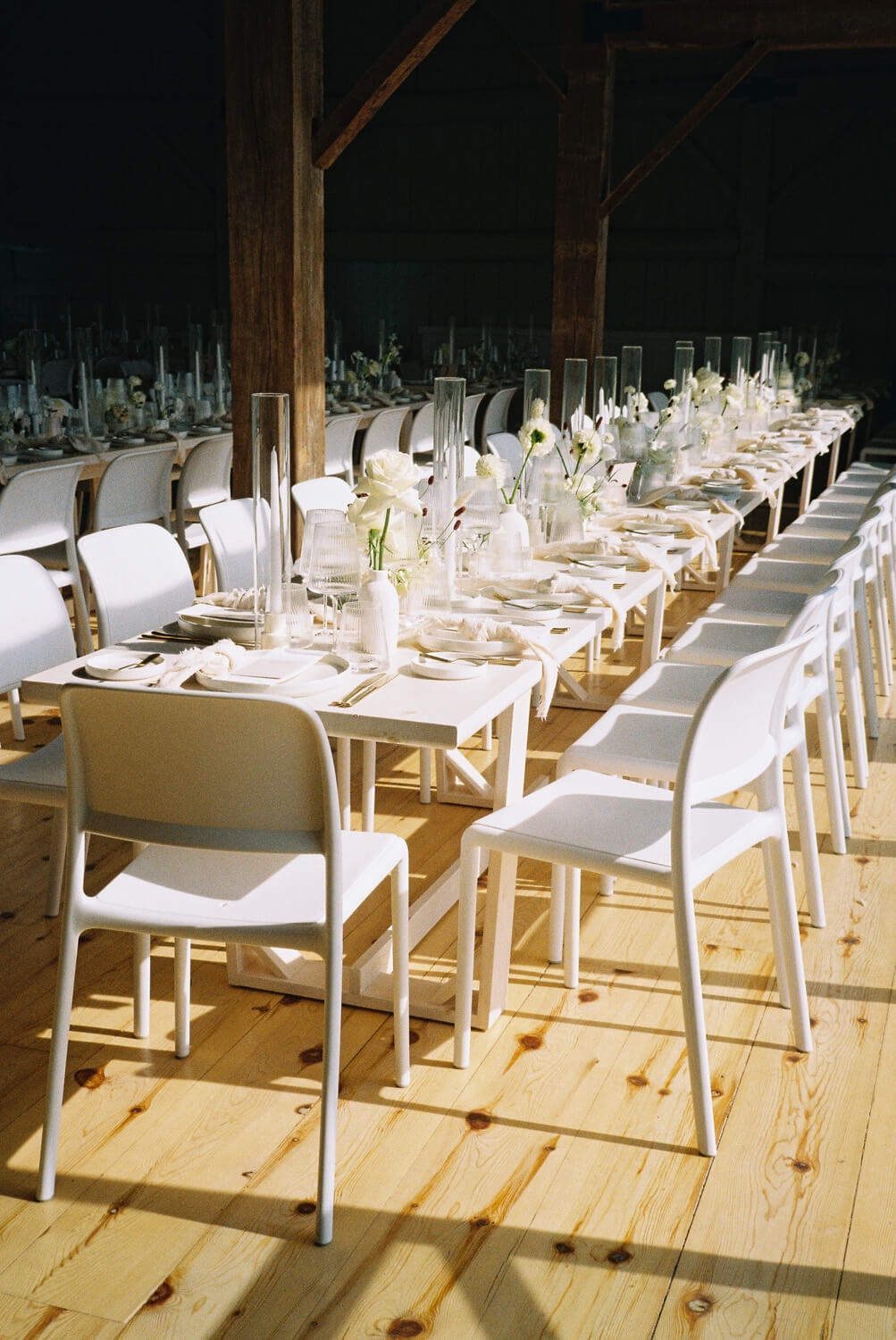 all white chairs and table for farmhouse wedding