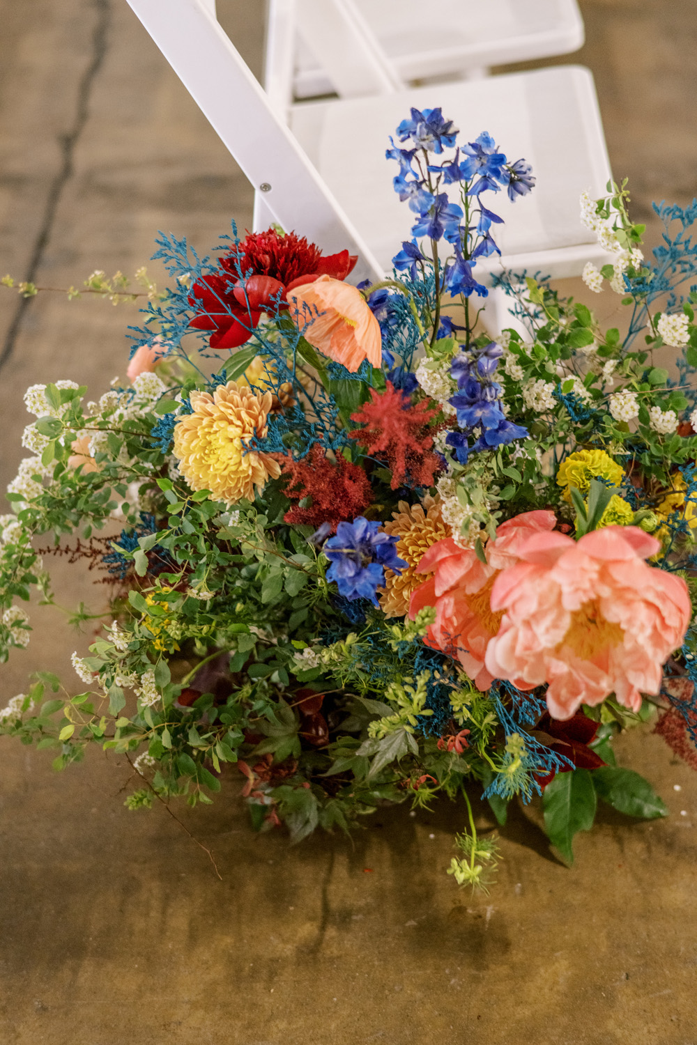 coral peonies in colorful floral arrangement