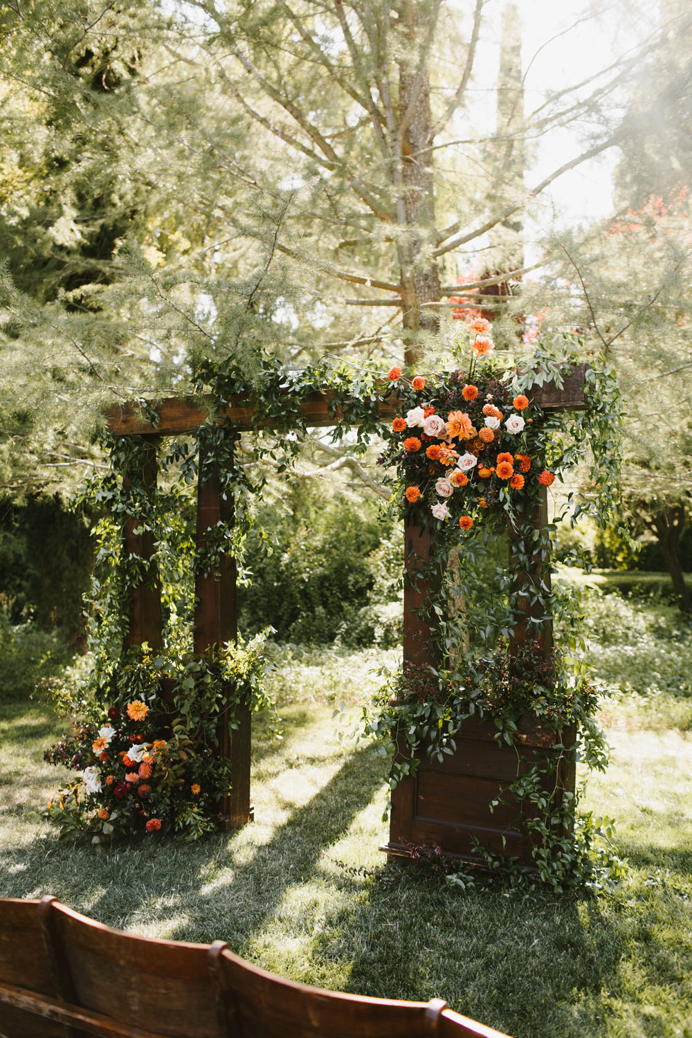 Orange dahlias for wedding ceremony