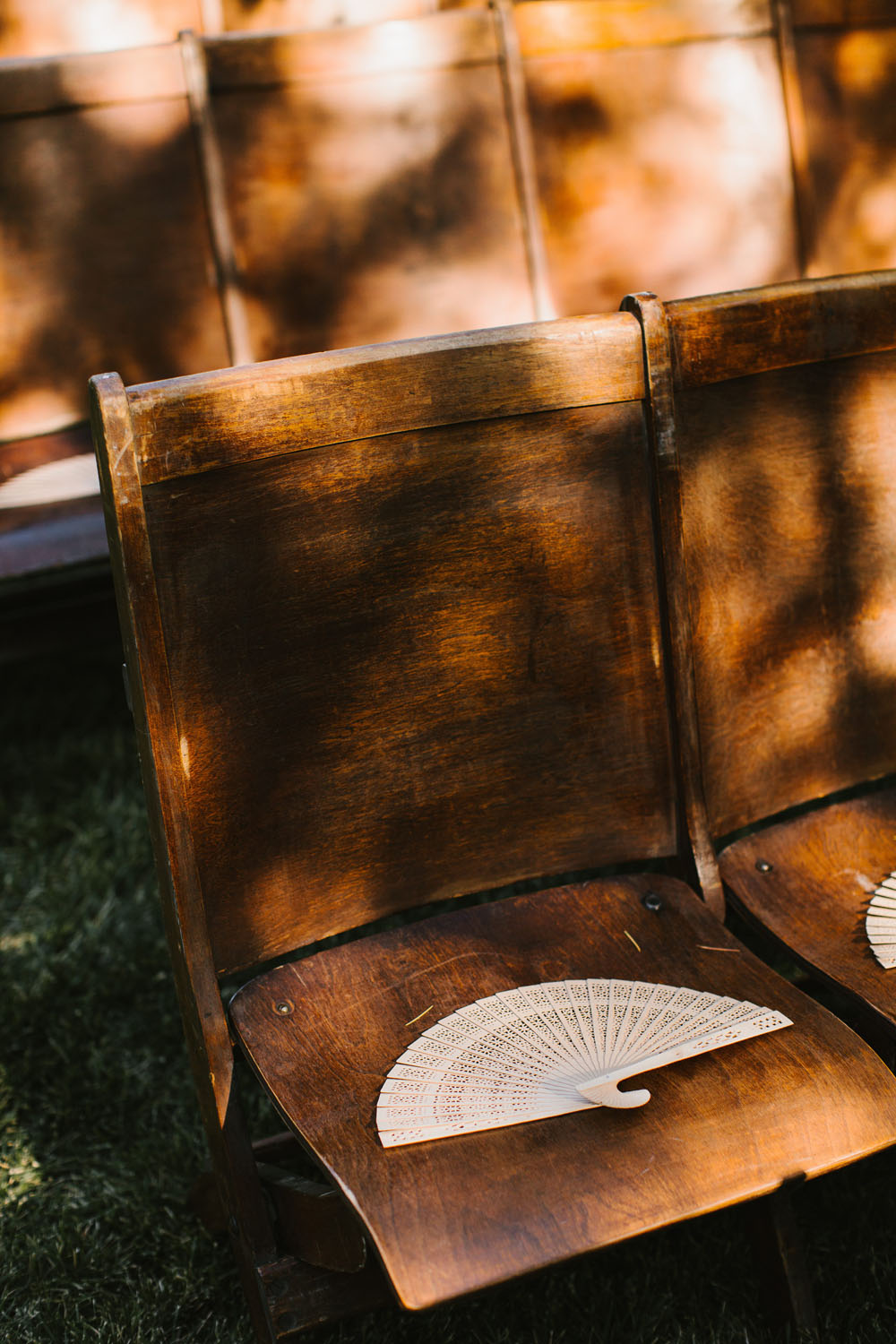 fans and rustic wedding chairs