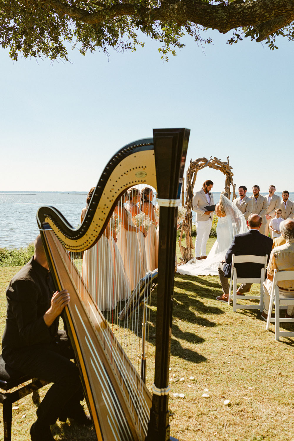 Harp player at beachy wedding