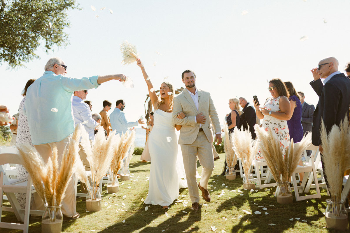 bride and groom at beach wedding ceremony