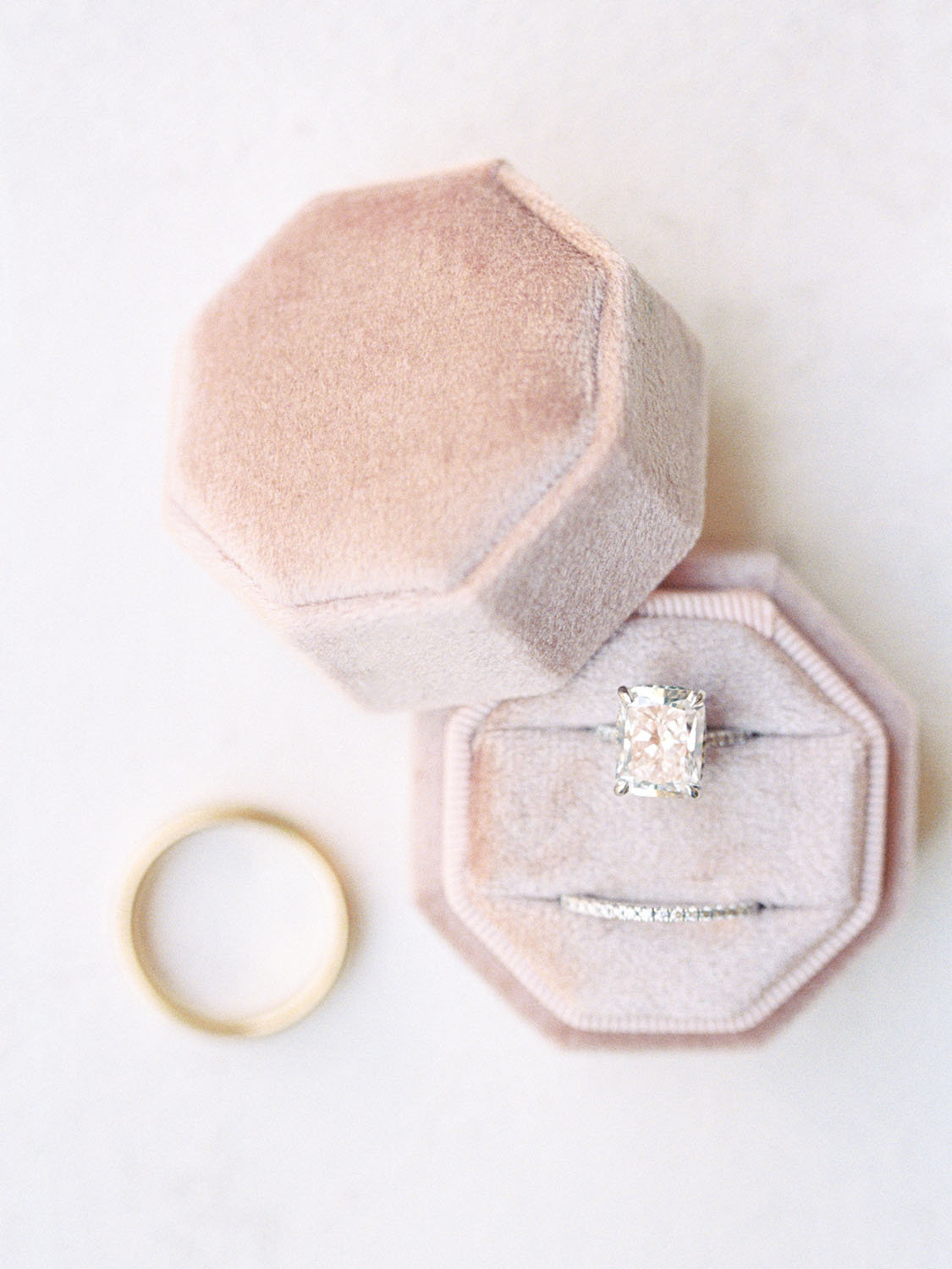 Wedding ring and pink ring box
