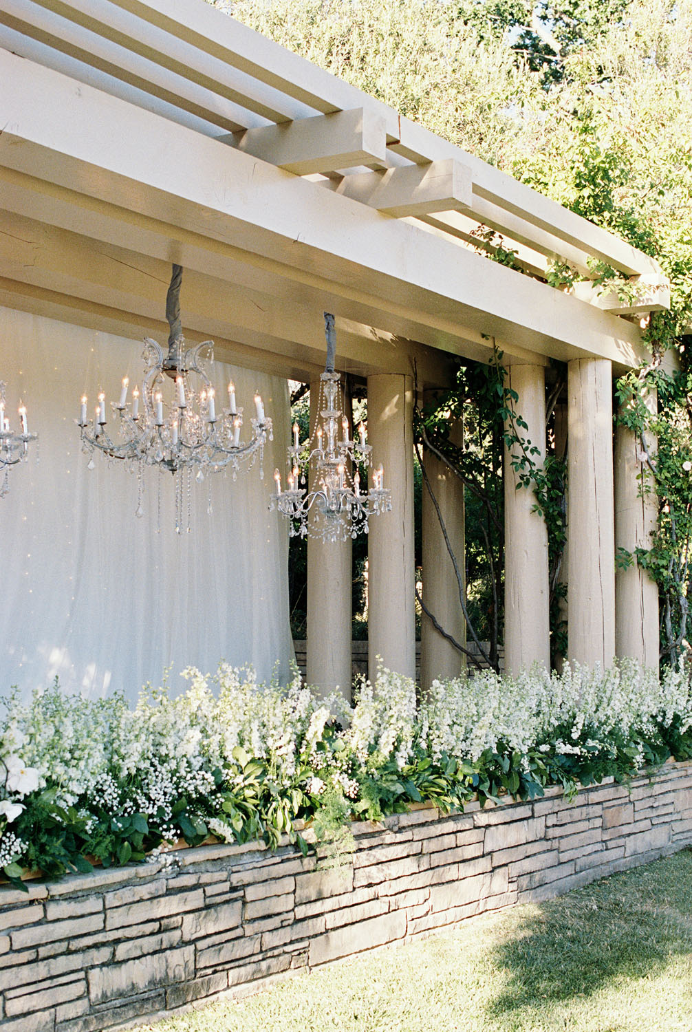 Greenery and outdoor chandeliers for wedding