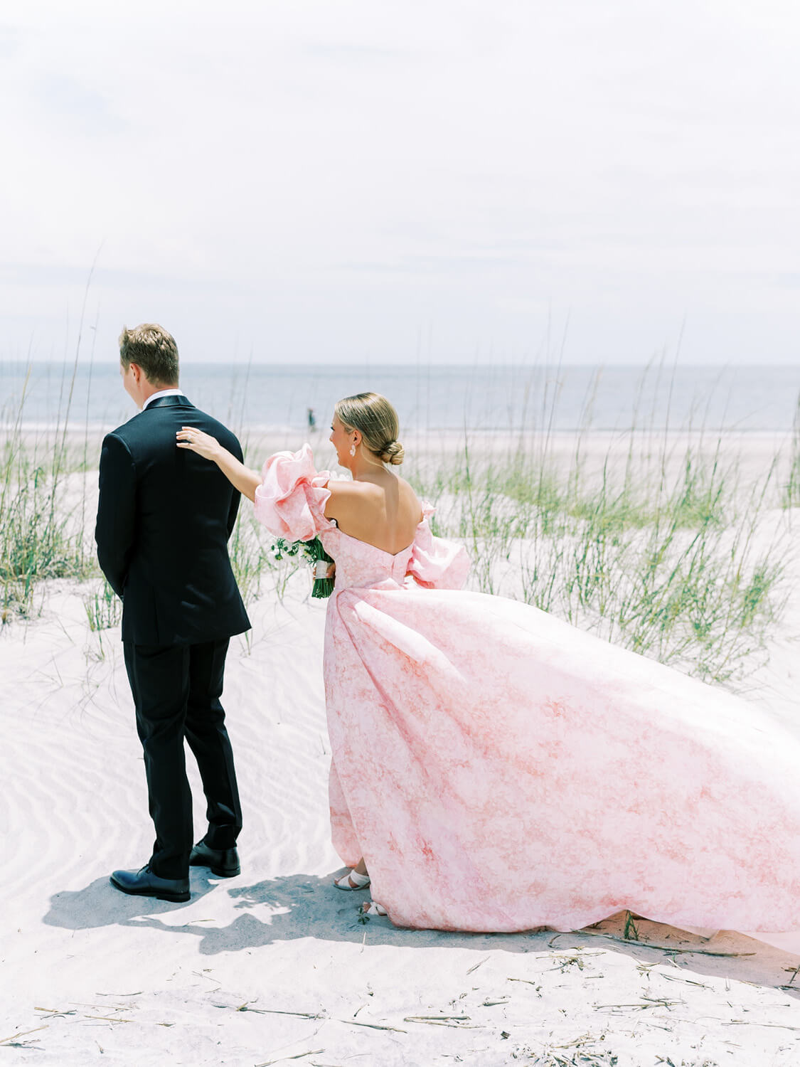 beachside first look with pink dress at hilton head wedding
