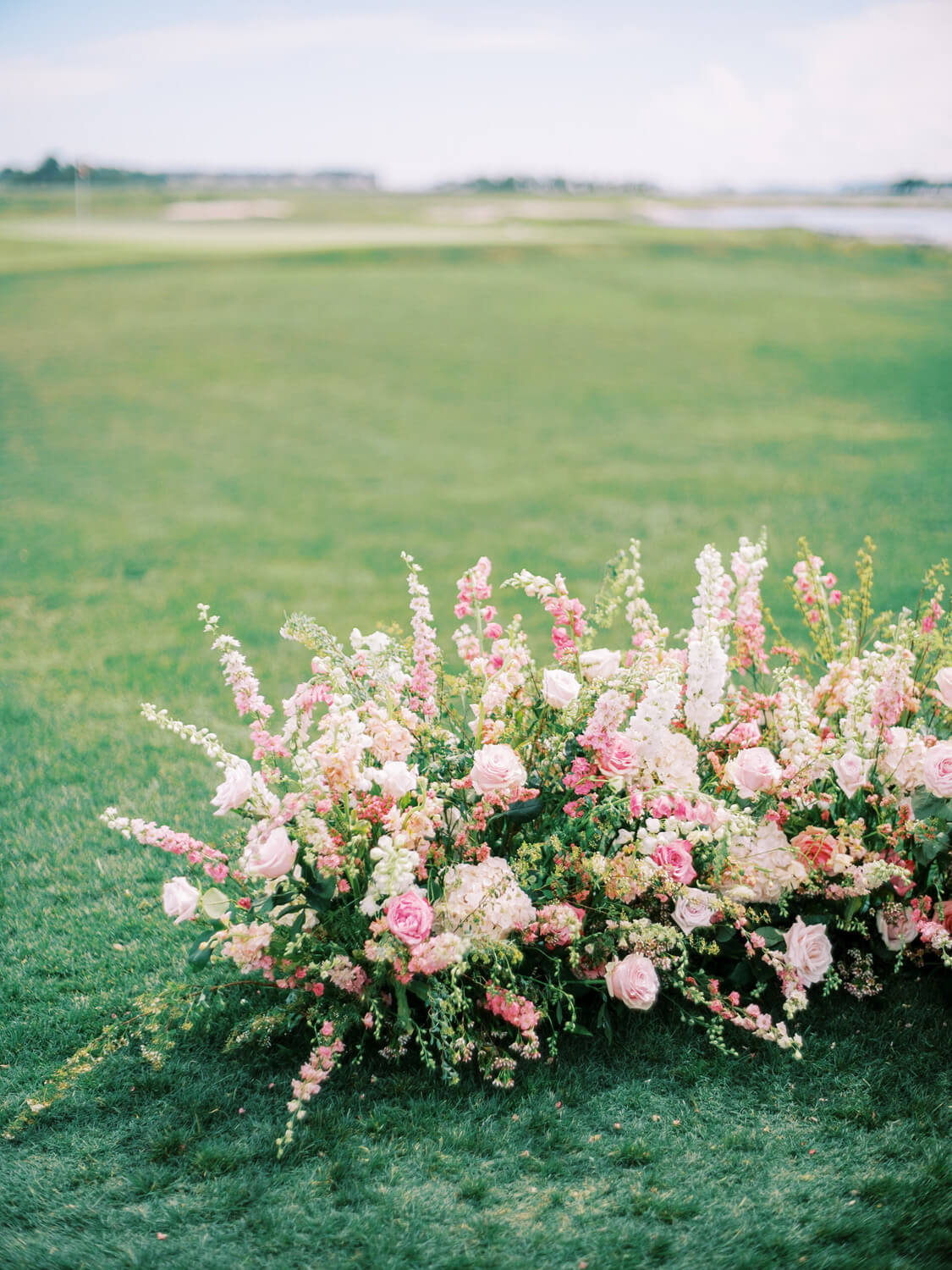 low ceremony florals for beachside wedding