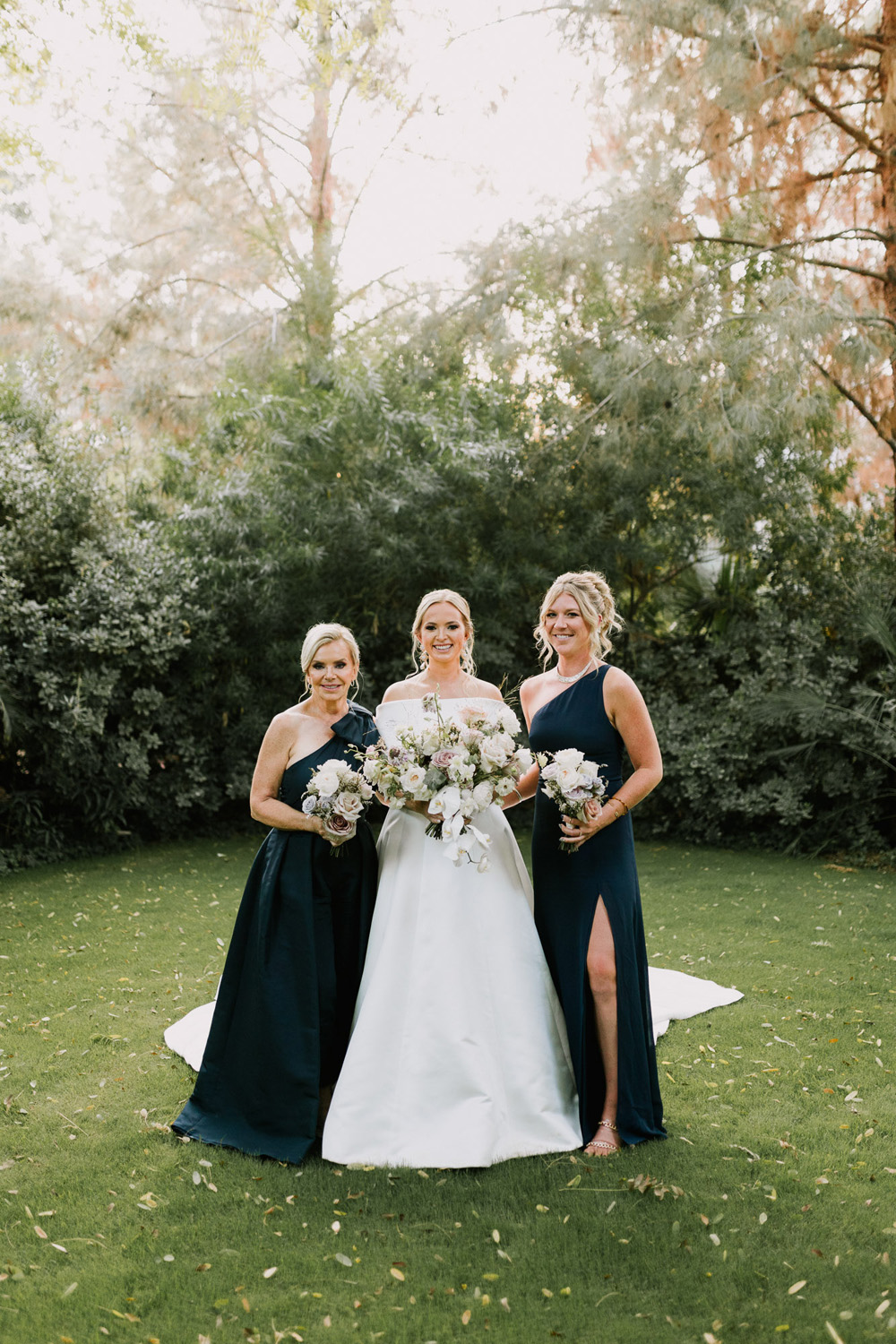 bridal portrait with bridesmaids in navy