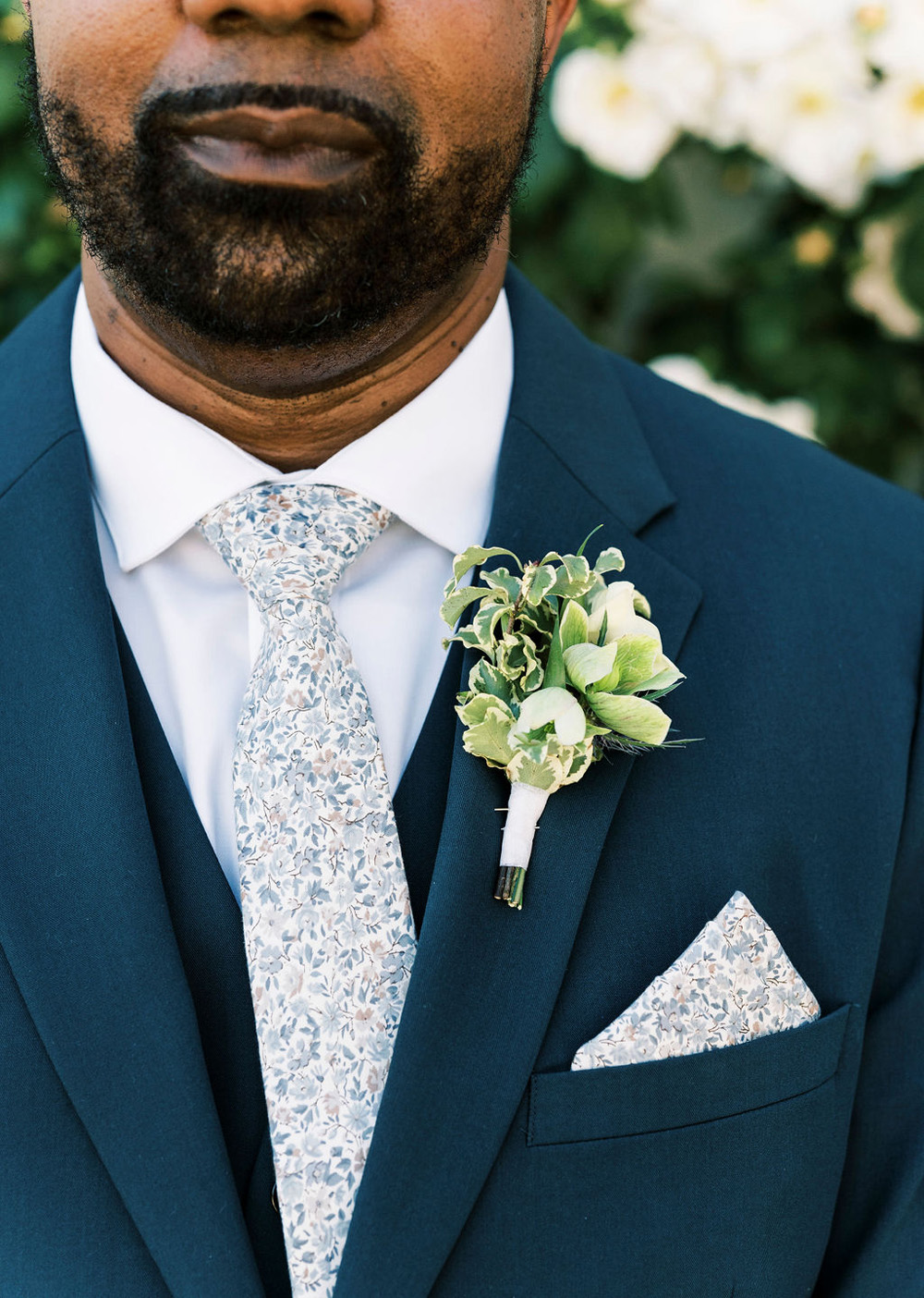 blue groom with floral tie