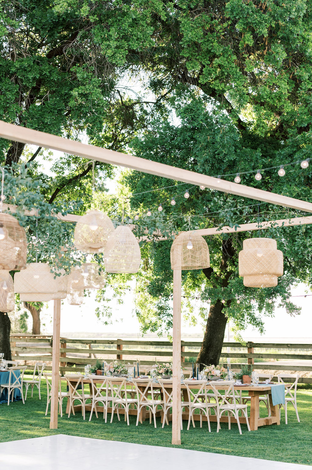 outdoor wedding reception with hanging lanterns