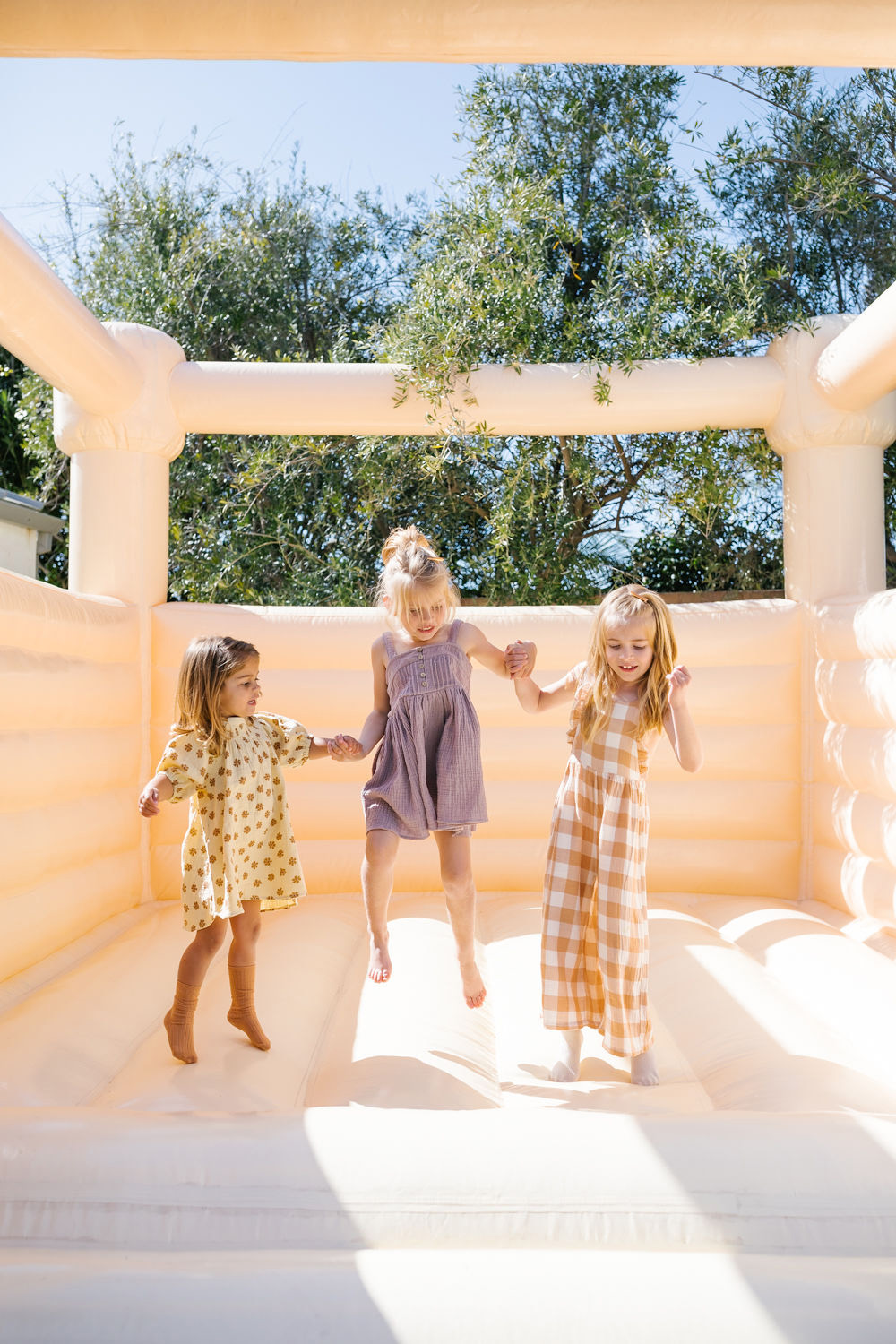 girls in bounce house at sister birthday party