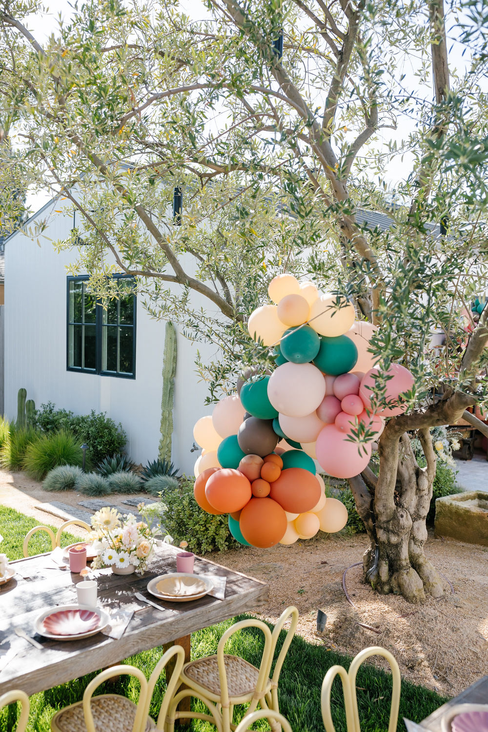 colorful balloon decorations at backyard kids birthday