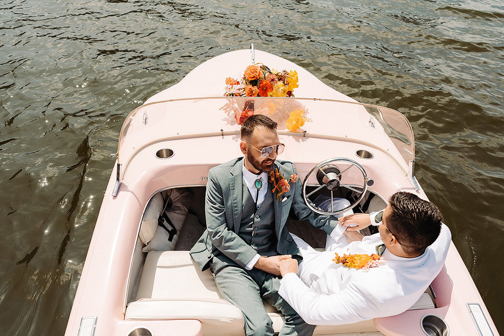 wedding portrait at Retro Boat Rental's pail-pink boat, “Gidget"