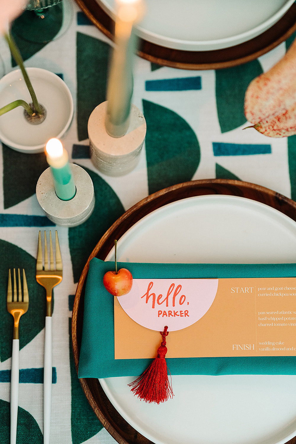teal, orange, and blush place settings