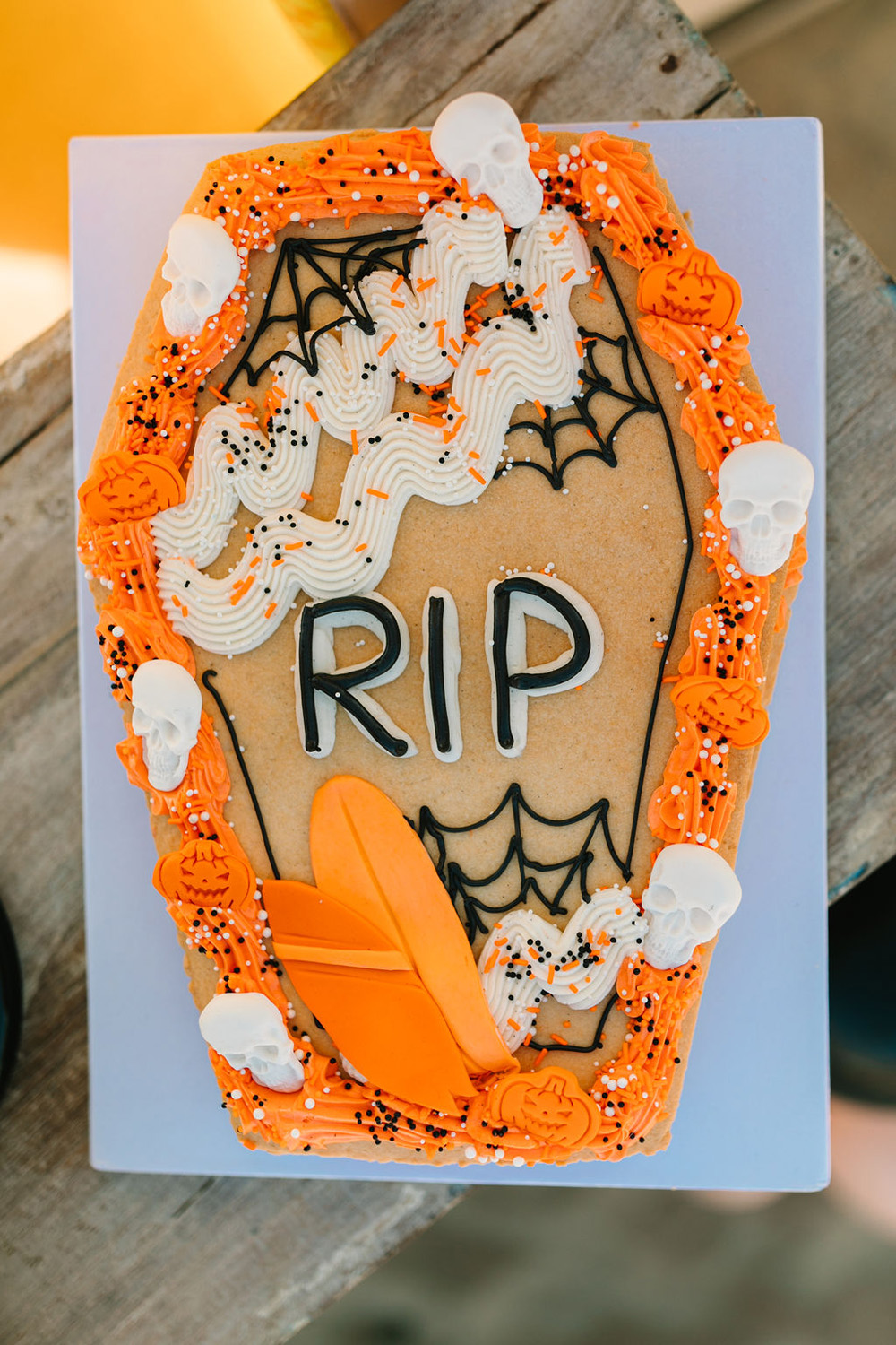 Orange and black Halloween birthday cookie for surf themed California beach birthday