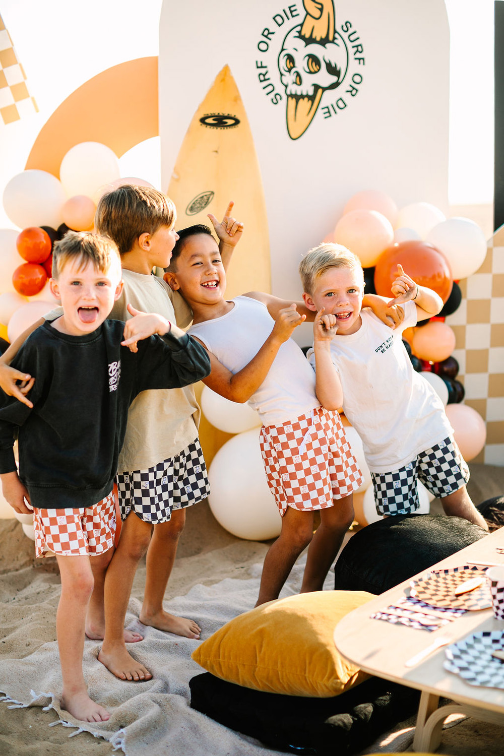 boys portraits at surf or die themed halloween party on the beach