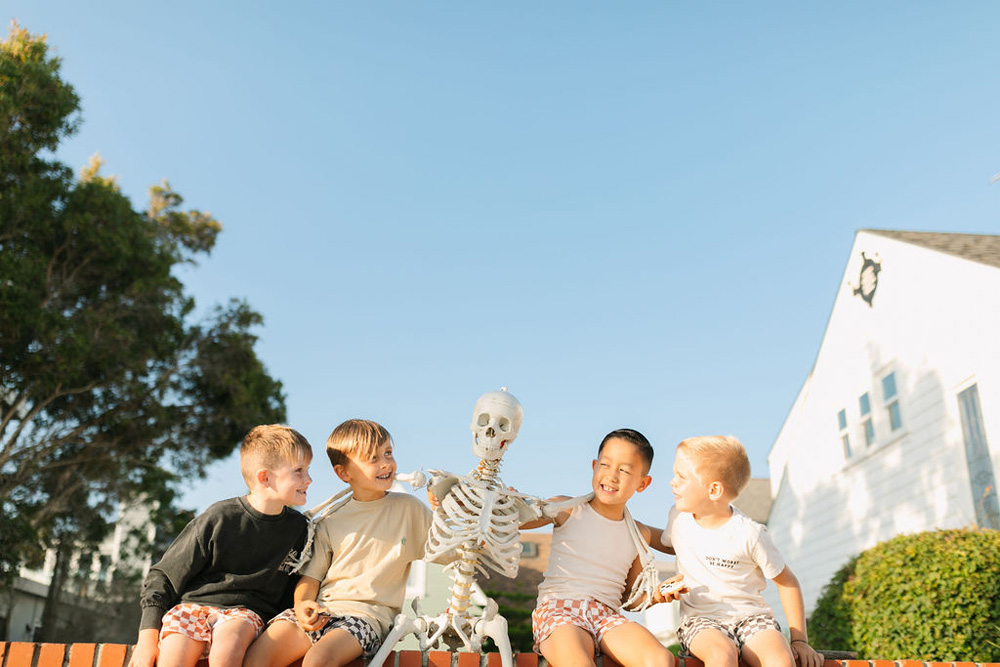 boys portraits at surf or die themed halloween party on the beach