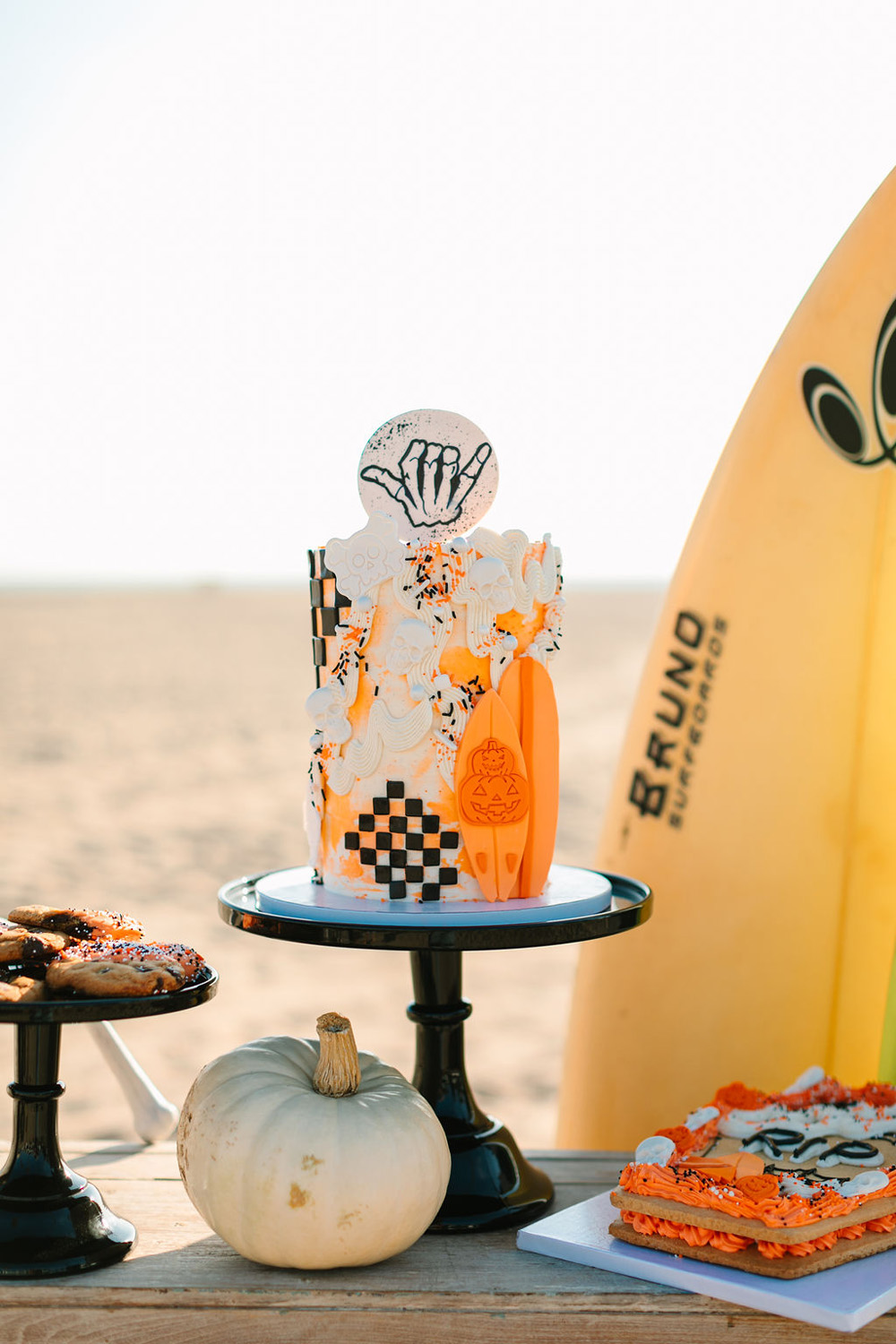 Orange and black Halloween birthday cake for surf themed California beach birthday