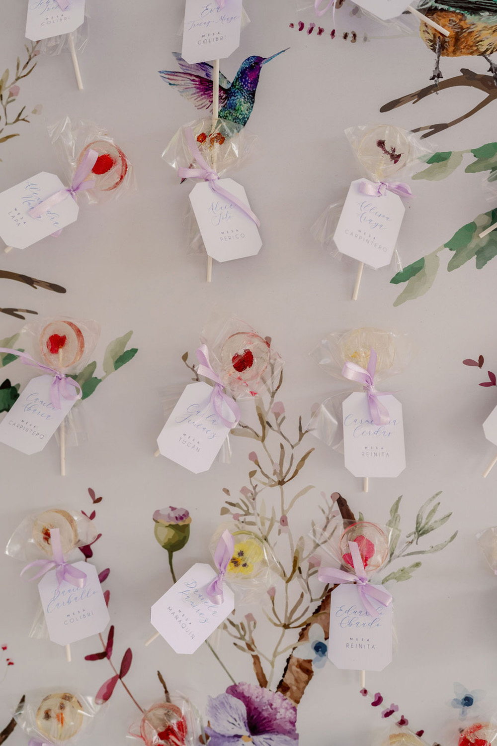 garden themed seating chart with floral lollipops for Quinceañera party