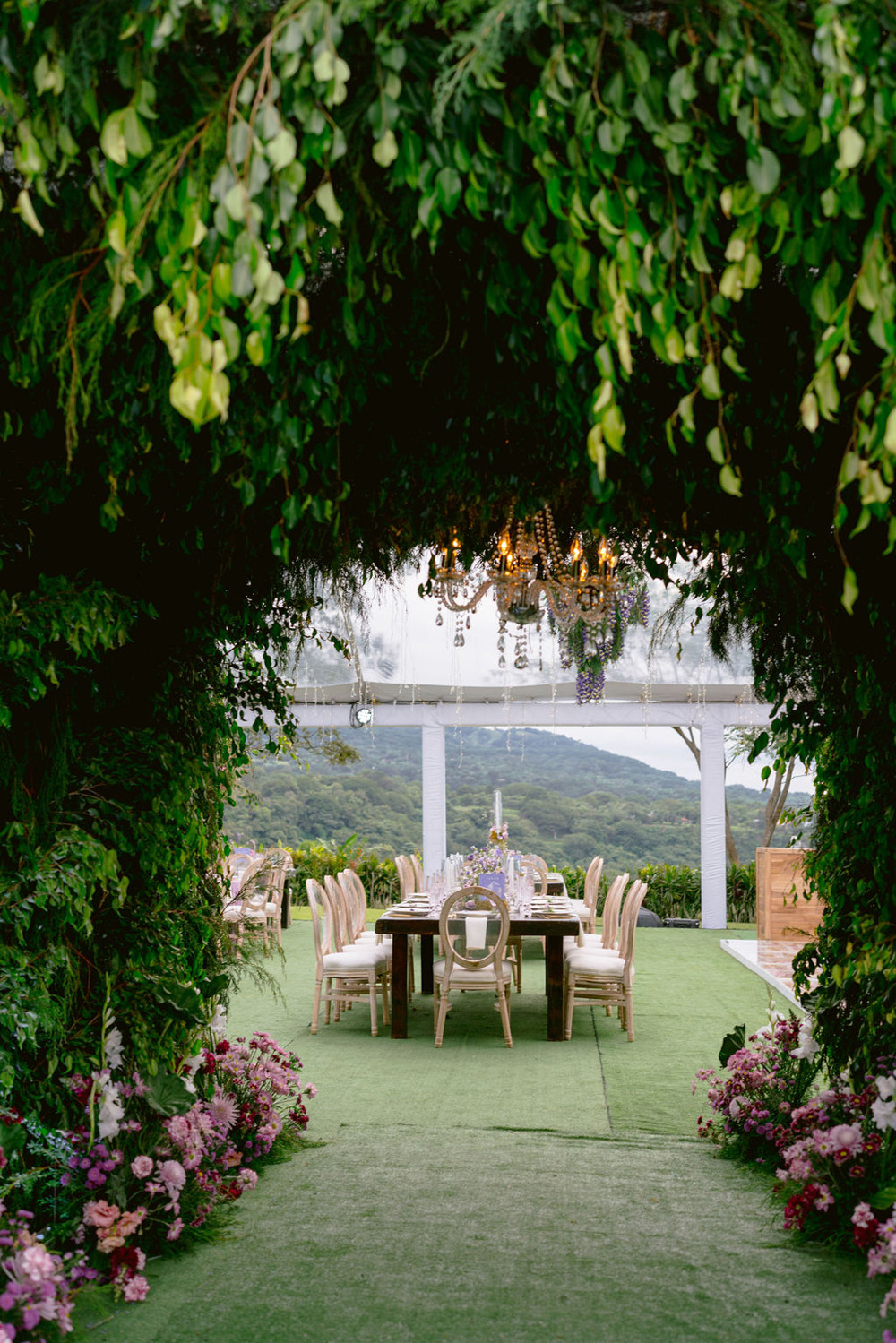 lush garden themed floral entrance to reception