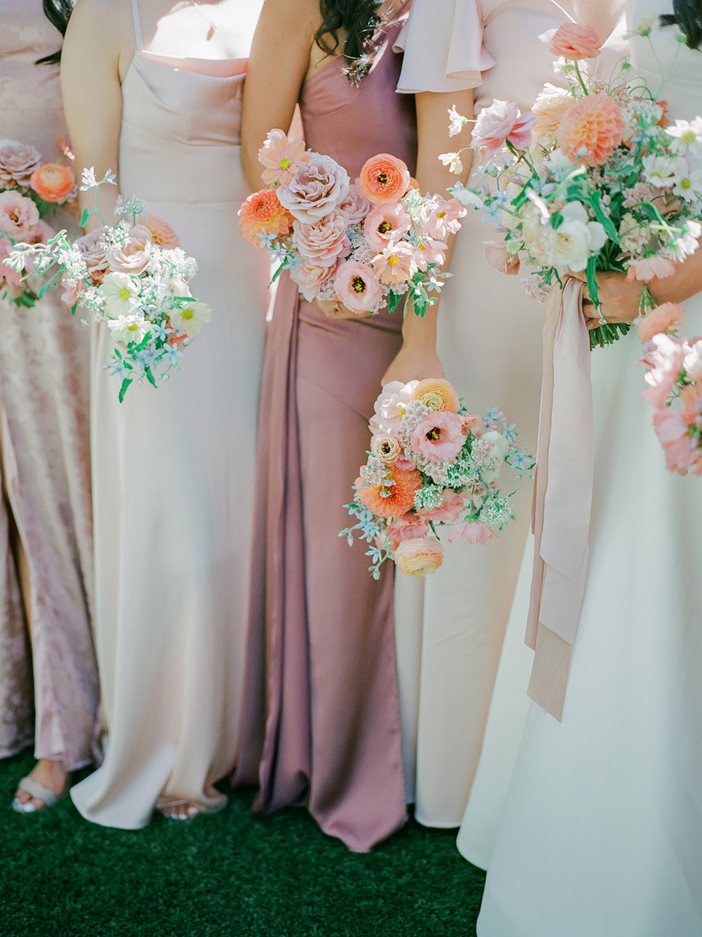 pink bridal party in backyard wedding ceremony