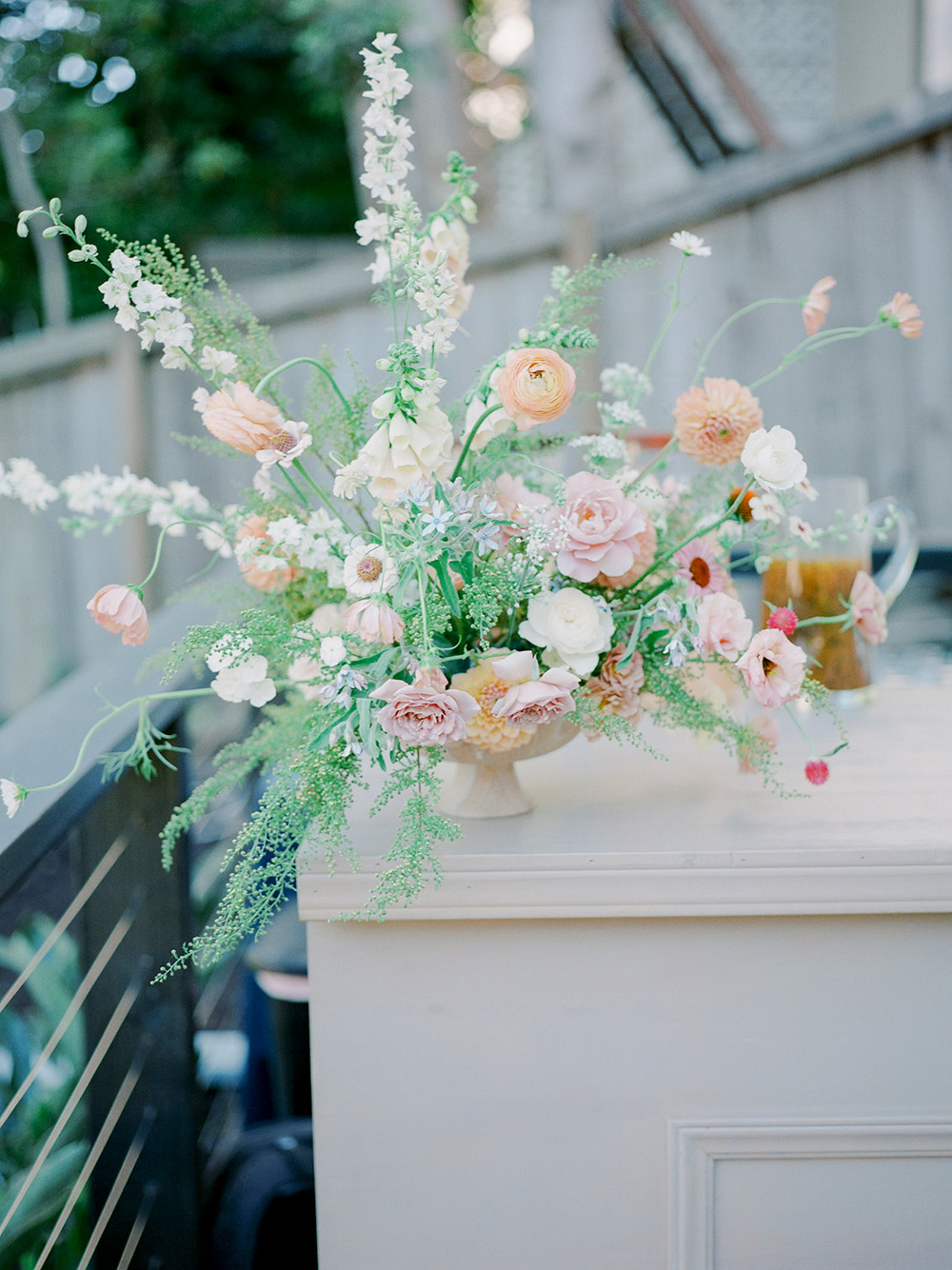 spring blush floral arrangement for wedding bar